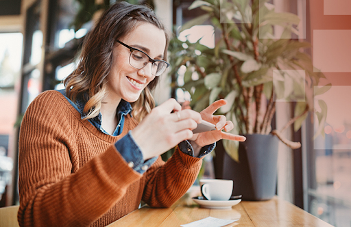 Using mobile banking to make a deposit, showcasing the convenience of credit unions.